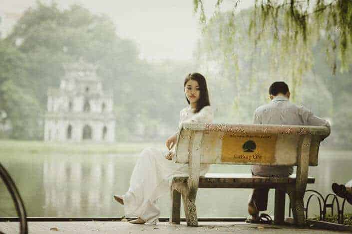 Woman Sitting on Bench Outdoors