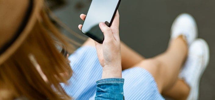 Woman Scrolling on Her Phone