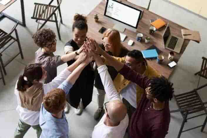 Workmates huddling 