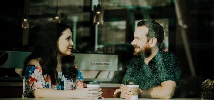 couple drinking coffee inside cafe