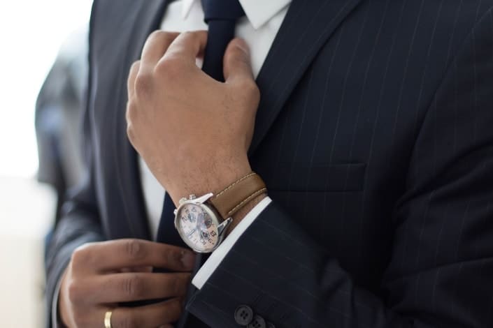 man fixing his suit