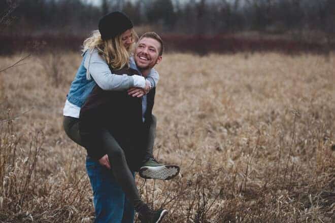 Woman riding on her boyfriend's back - how to get a boy to like you