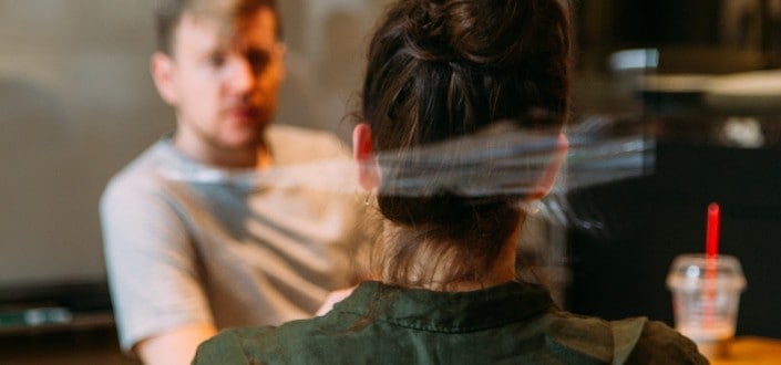 Couple talking to each other at cafe