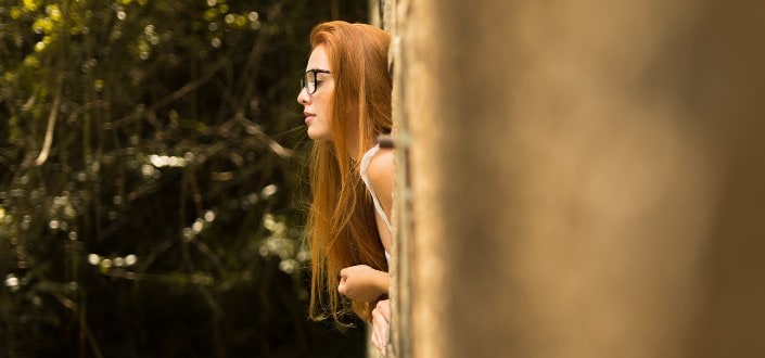 Girl leaning out a window