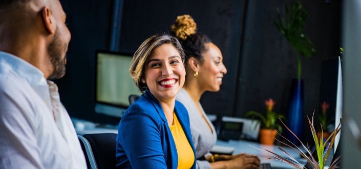 Coworkers smiling at each other