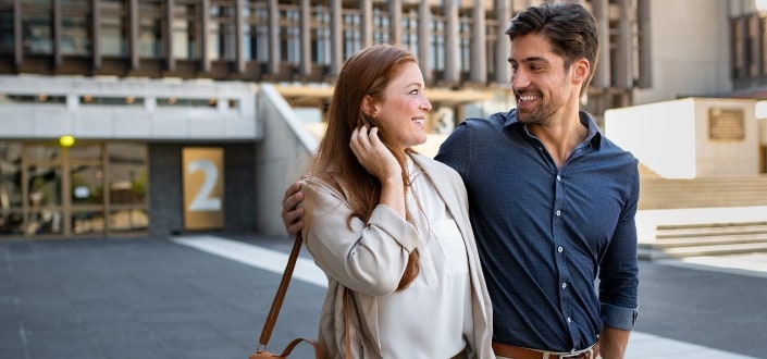 Couple walking out of a building