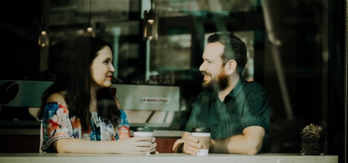 Couple having conversation over coffee