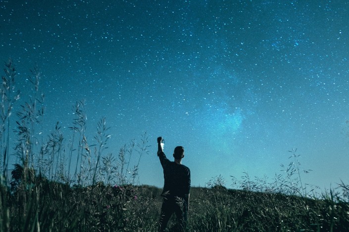 Guy being mesmerized by the starry sky
