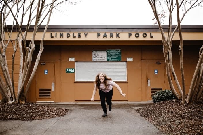 Girl running towards camera like an animal