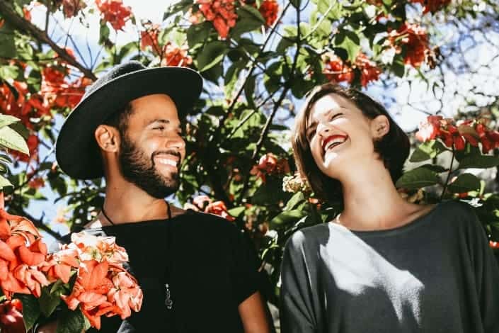 couple laughing together under the tree