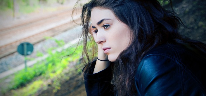Serious woman looking at nowhere