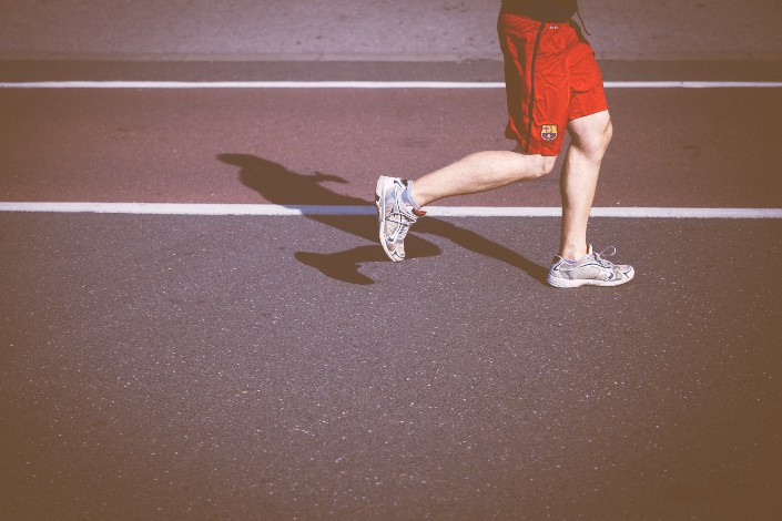 athlete in sneakers running