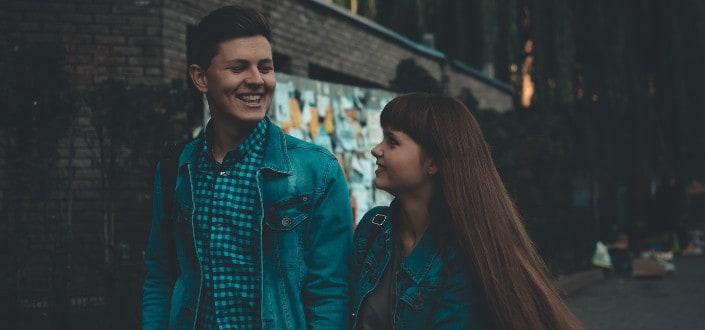 couple looking at each other while walking