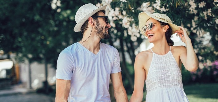 Couple Walking Beside Each Other And Smiling
