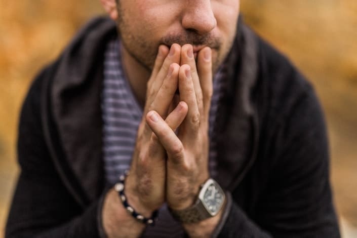 Guy With His Hands on His Lips