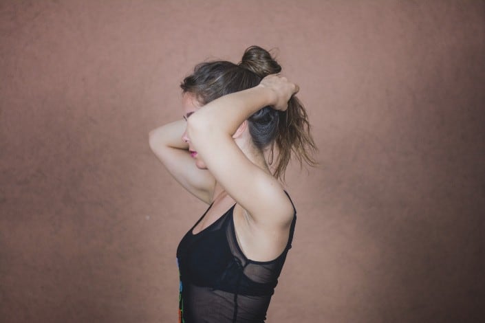 Girl Tying Her Hair With Her Hands