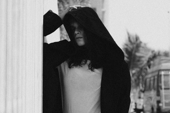 Girl in Solemn Mood Wearing a Hoodie
