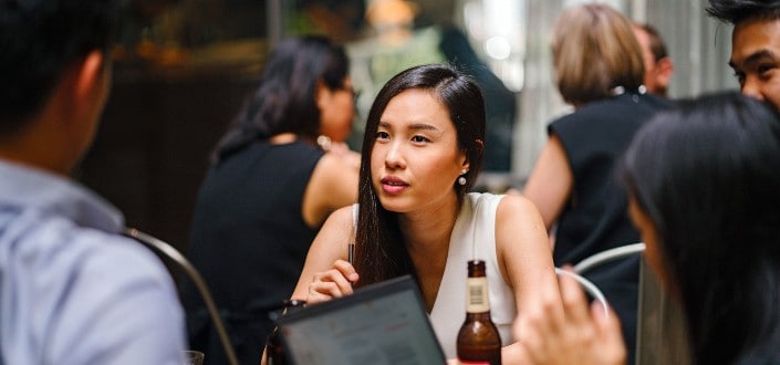 Girl talking to a guy.
