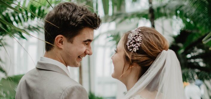man and woman looking at each other during wedding