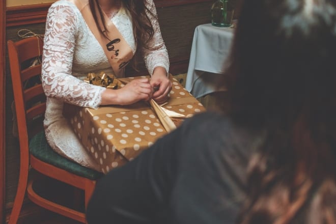 Bride Opening A Gift - Bridal Shower Gifts