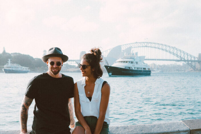 couple bonding beneath a shoreline.