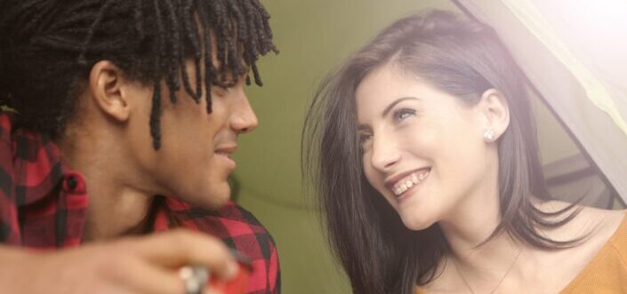 diverse couple smiling at each other