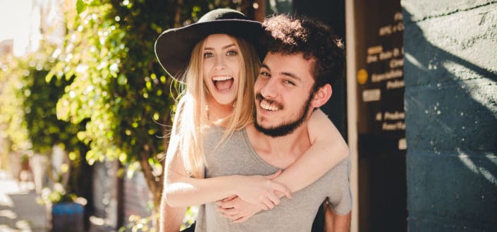 woman piggybacking off a man