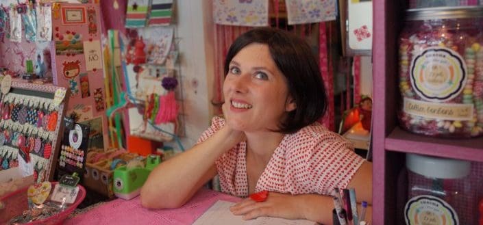 A lady store owner thinking about something