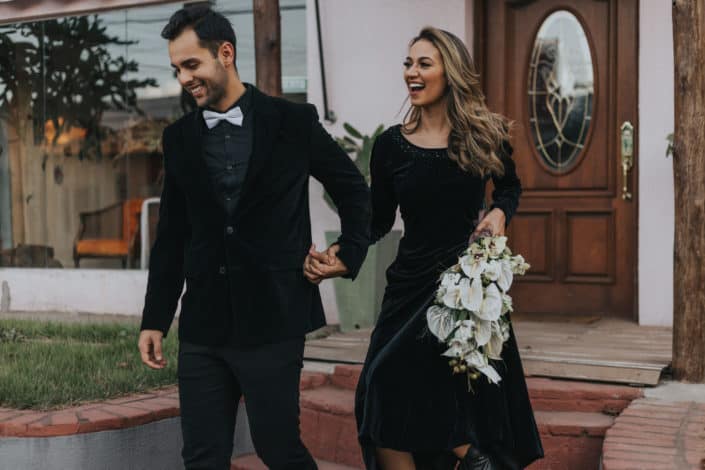 Young couple walking out of a wedding