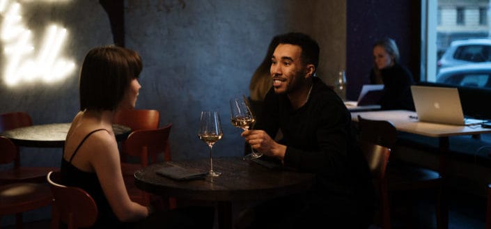 Couple drinking wine at the bar