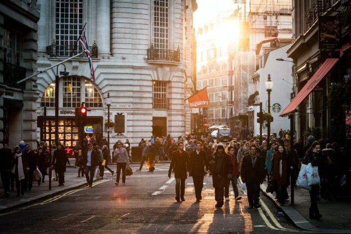 People gracing the busy city streets.