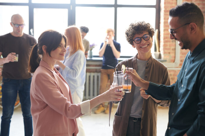 Friends, toasting drinks and enjoying together.