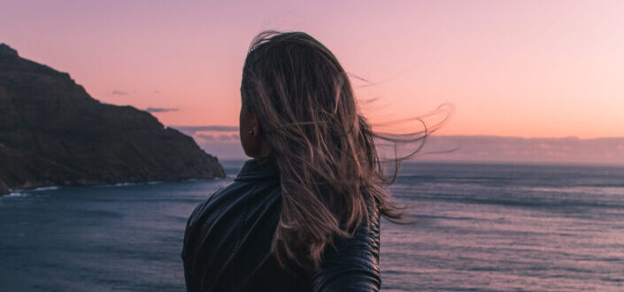 A woman feeling the sunset view.