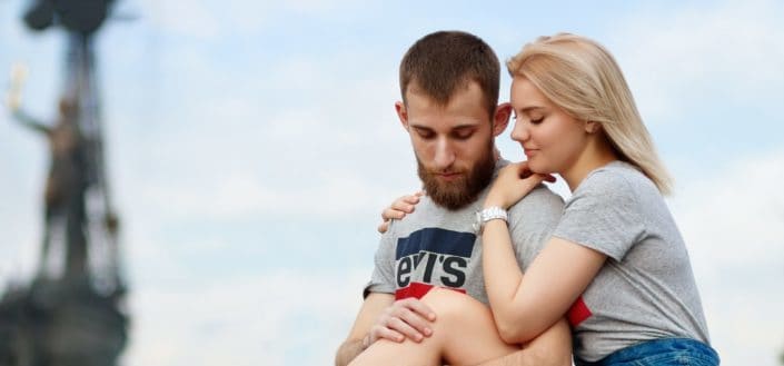 Girl Hugging Guy From Behind With Her Leg Up