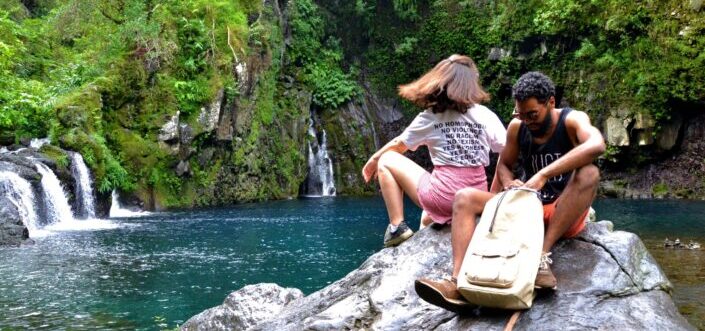 Couple sitting by the falls