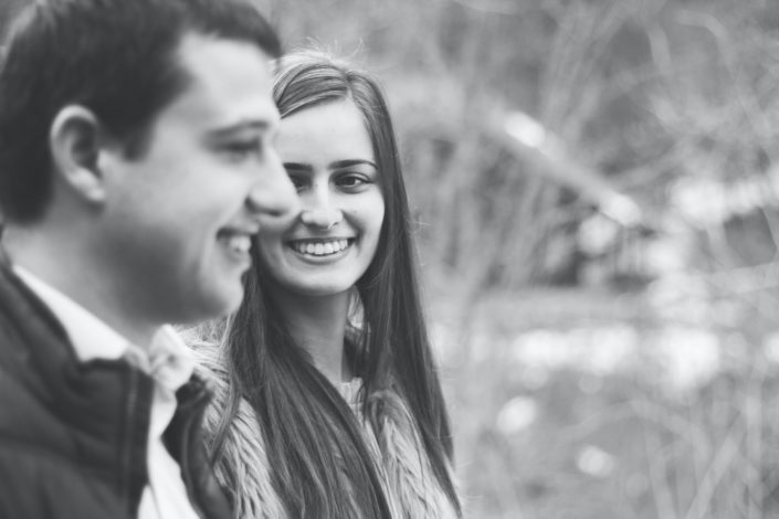 A woman smiling while staring at his man