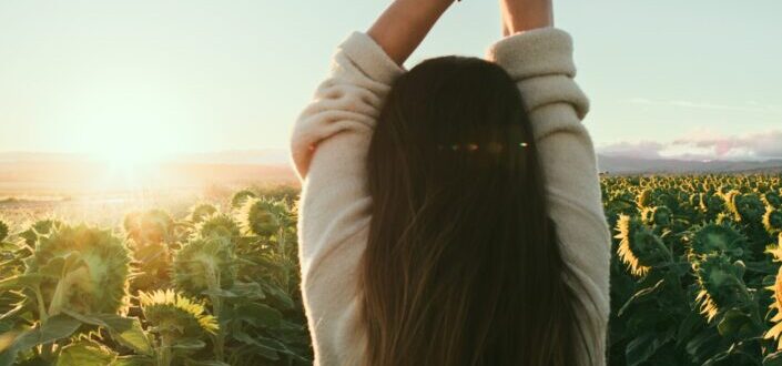 A girl enjoying the sunrise.