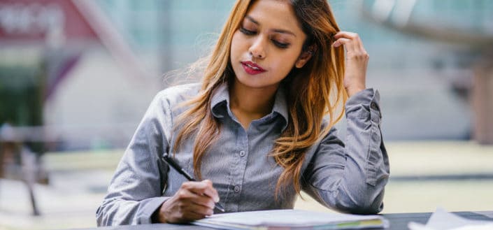 Working woman writing down notes