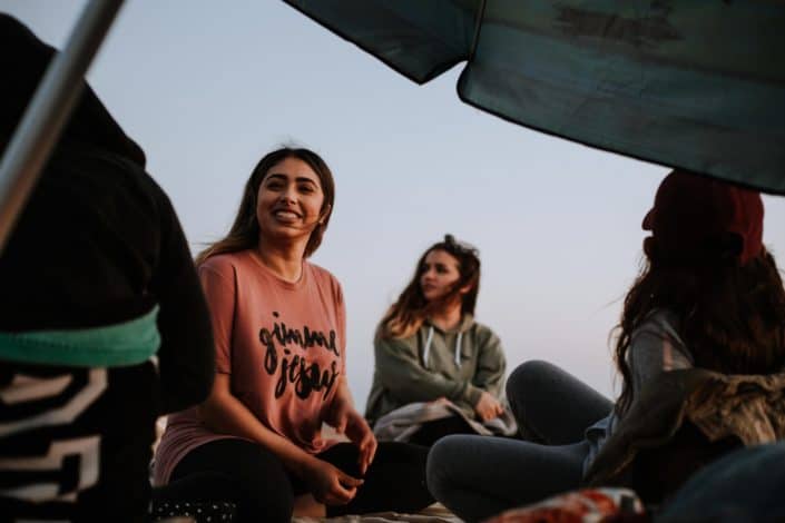 Group of friends having a picnic outside