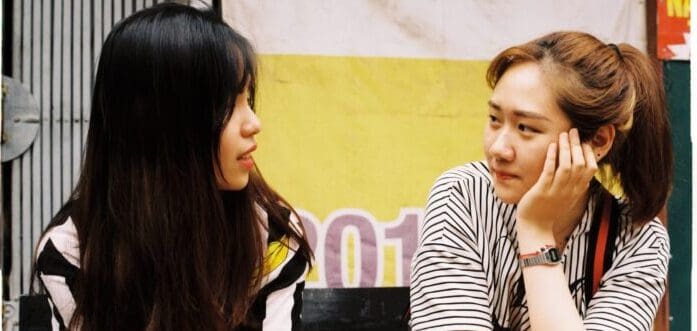 Two girls having a serious conversation.