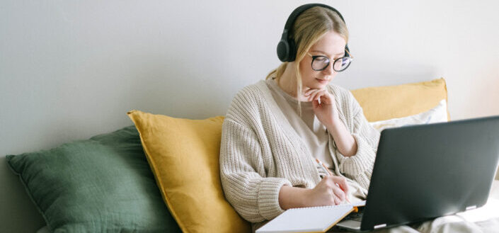 woman studying and taking notes