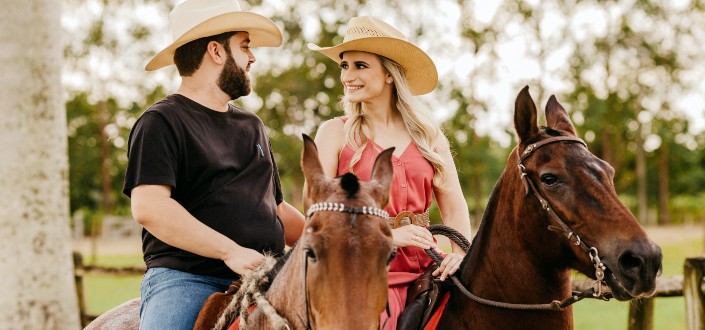 a couple riding horses