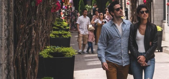A couple walking in a busy street