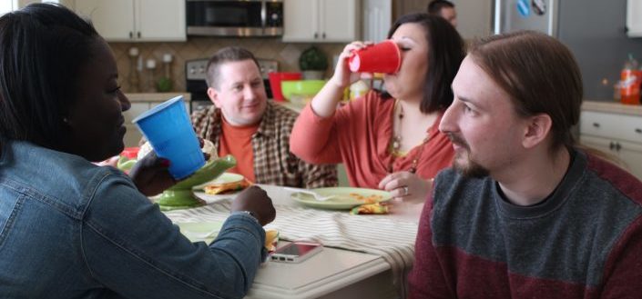 group of adults hanging out together