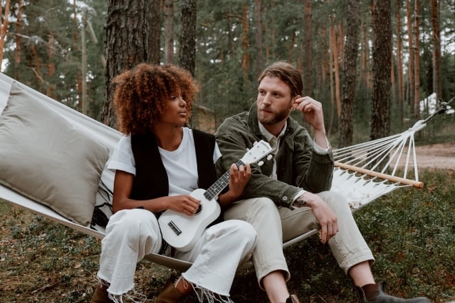 Woman playing ukulele beside a man - random questions to get to know someone