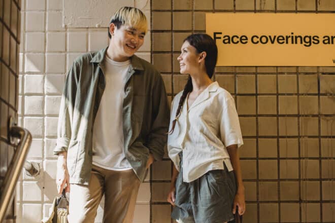 two people standing while smiling - deep personal questions