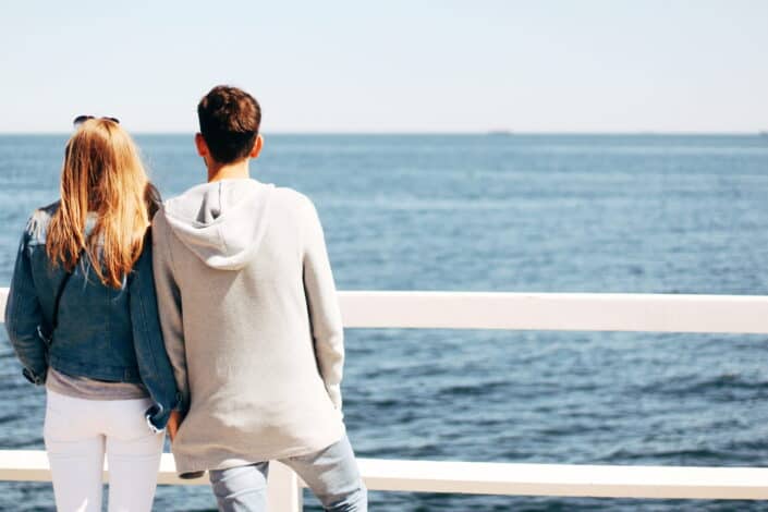 couple Beside Wooden Hand Rail 