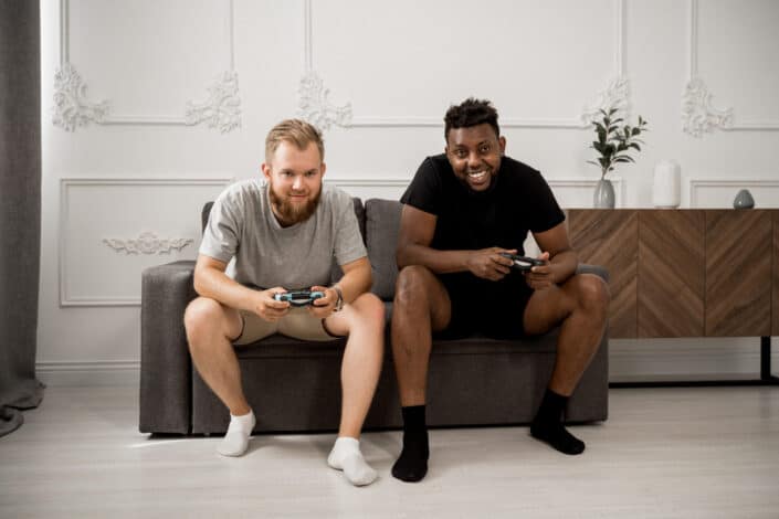 multi-ethnic friends playing video game
