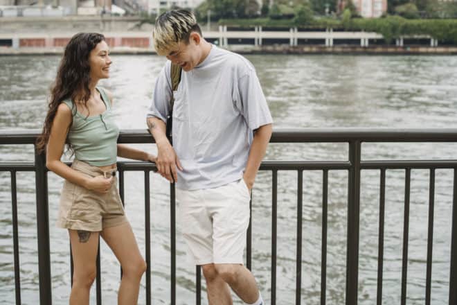 Couple standing in front of a pond - personal questions to ask