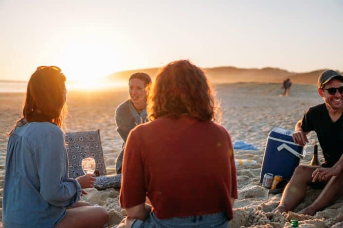 friends hanging out near beach